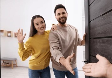 Happy guests arriving at a perfectly cleaned vacation rental